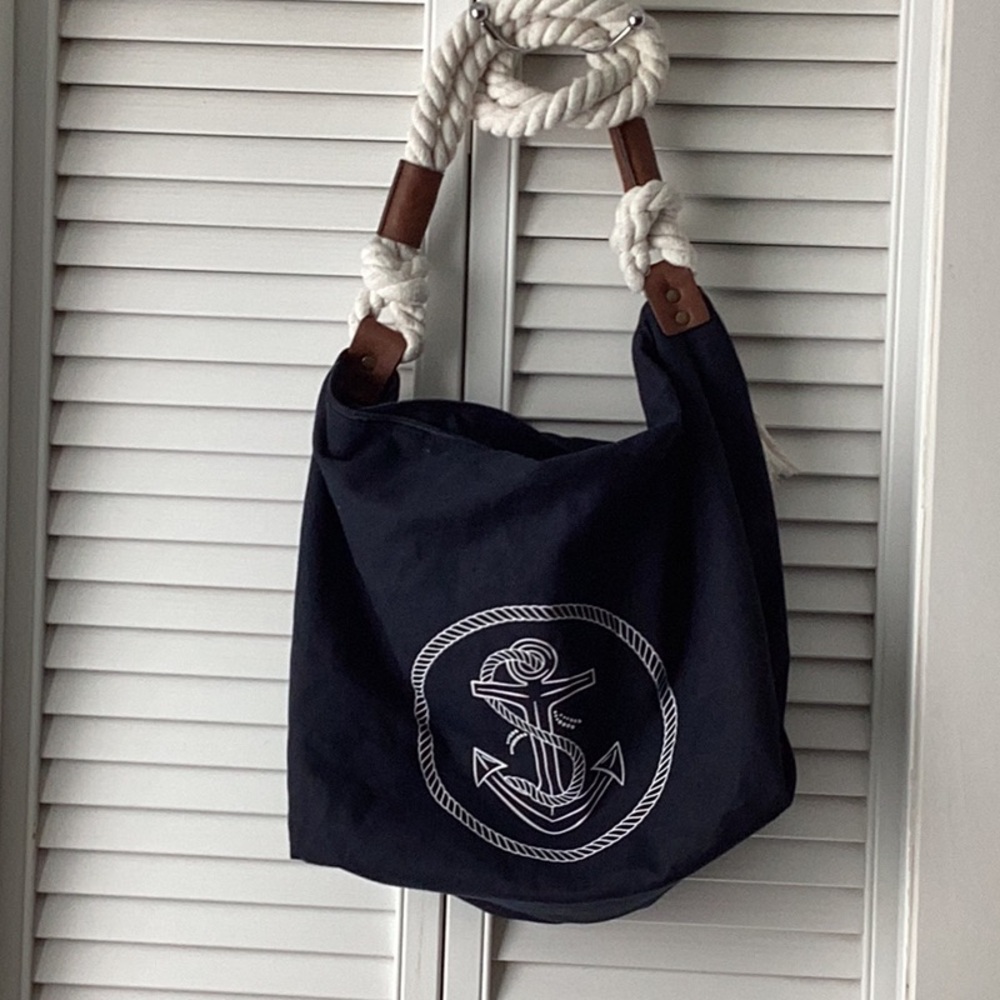 Black and White Shoulder Bag with Textured Fabric and Emblem